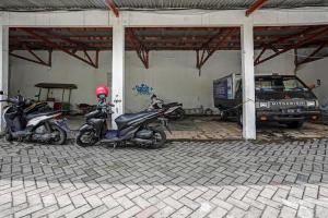 a group of motorcycles parked in a garage at De Plaza Hotel in Surabaya