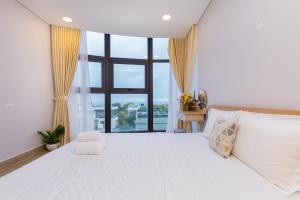 Tempat tidur dalam kamar di Aria Vũng tàu