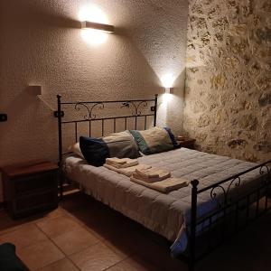 מיטה או מיטות בחדר ב-LA BAITA DEL CONTE