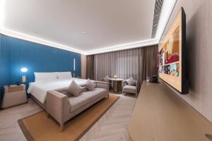 Postel nebo postele na pokoji v ubytování Crystal Orange Hotel - Shenzhen Nanshan Xinhaofang Branch + 37 fotografií