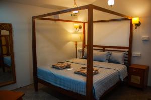 Letto o letti in una camera di COCO CABANA
