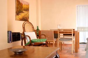a living room with a dining room table and chairs at EL TEULAR DE CARMEN in Banyeres de Mariola