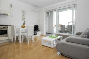 Posezení v ubytování Apartments Tomana