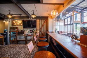 Et tv og/eller underholdning på Vintage54 Hotel Ayutthaya