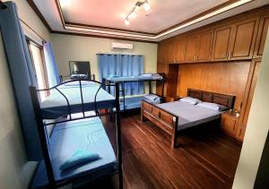 A bed or beds in a room at Leynes Taal Lake Resort and Hostel