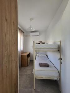 a bedroom with two bunk beds in a room at St Julian Apartments in St Julian's