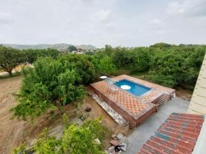 an overhead view of a backyard with a swimming pool at JHALANA RETREAT RESORT in Jaipur