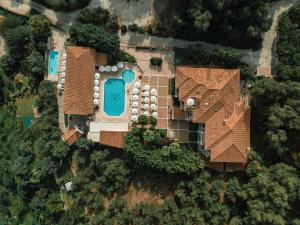 an overhead view of a house with a swimming pool at Dracos Hotel in Parga