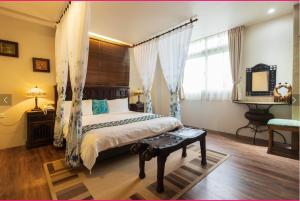 Rúm í herbergi á Yilan Ya Lu Homestay