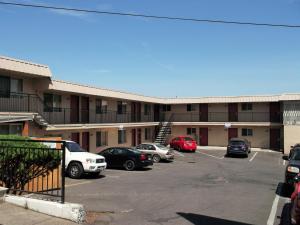 a parking lot in front of a building at Portland Value Inn & Suites in Portland