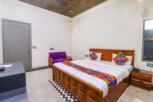 En eller flere senge i et værelse på Via Be Happy