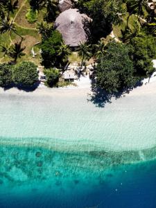 an aerial view of an island in the ocean at Gili Asahan Eco Lodge & Restaurant in Gili Asahan