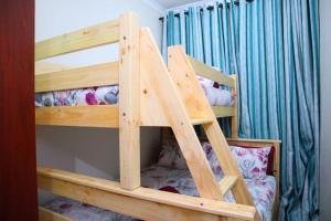 a couple of bunk beds in a room at Manzini Chalet 39 in St Lucia