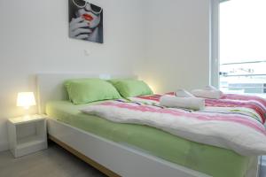 Postel nebo postele na pokoji v ubytování Apartments Tomana