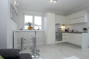 Kuchyň nebo kuchyňský kout v ubytování Apartments Tomana