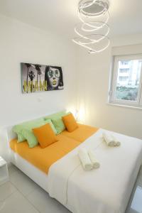 Postel nebo postele na pokoji v ubytování Apartments Tomana
