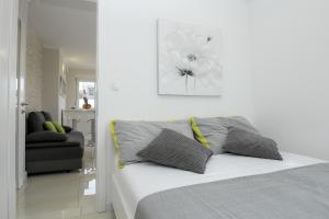 Postel nebo postele na pokoji v ubytování Apartments Tomana