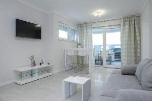 TV a/nebo společenská místnost v ubytování Apartments Tomana