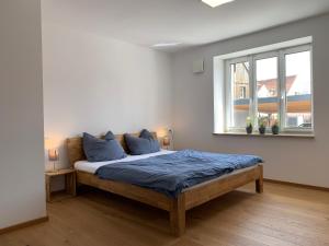 Postel nebo postele na pokoji v ubytování Frundsberg-Apartment + 36 fotografií