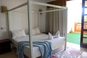 Postel nebo postele na pokoji v ubytování Symphony Seafront House Mombasa + 13 fotografií