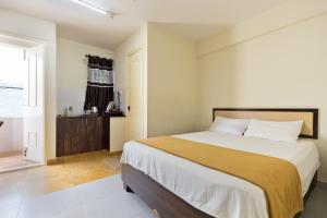 Кровать или кровати в номере Stayhome Classic