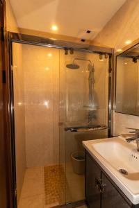 a bathroom with a shower and a sink at Johannes Condo in Baguio Megatower IV in Baguio