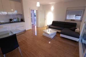 Kuchyň nebo kuchyňský kout v ubytování Apartments Tomana