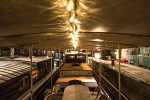 a boat with lights on the inside of it at Classic riverboat in the center of Paris in Paris