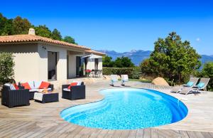 a villa with a swimming pool and a patio at Villa Alzitella in Sotta