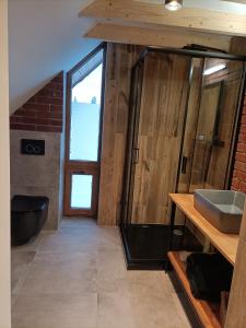 a bathroom with a sink and a large window at Czarna Chata in Jaworzynka +22 photos