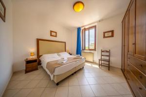 Postel nebo postele na pokoji v ubytování Resort Capalbio