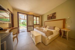 Postel nebo postele na pokoji v ubytování Resort Capalbio