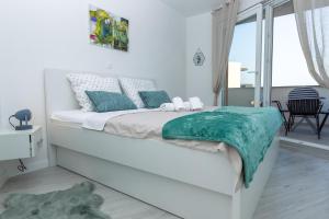 Postel nebo postele na pokoji v ubytování Apartments Tomana