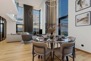 a dining room with a table and chairs at PH106 The best views in Tallinn! in Tallinn