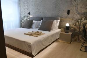 Postel nebo postele na pokoji v ubytování Panorama Hotel Friuli - Boutique Hotel