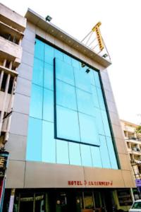 a building with a large glass window on it at Hotel Akashdeep, Ranchi in Rānchī
