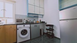 A kitchen or kitchenette at STAY Chrysanthemum City Apartment
