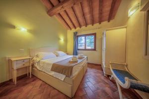 Postel nebo postele na pokoji v ubytování Resort Capalbio