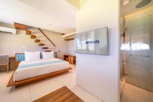 a hotel room with a bed and a staircase at IZE Canggu by LifestyleRetreats in Canggu