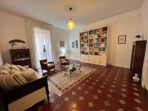 a living room with a couch and a table at "Le Muse" a Ercolano in Ercolano