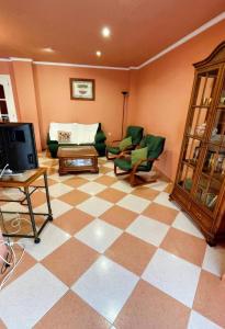 a living room with a checkered floor at Apartamento en Torreblanca Ref 061 in Torreblanca