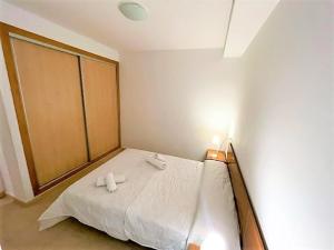 a bedroom with a bed with two towels on it at Apartment Grao de Moncofar Ref 041 in Moncófar