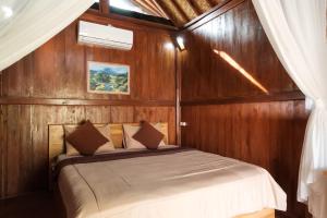 Ένα ή περισσότερα κρεβάτια σε δωμάτιο στο TwoSpaces Living at Balian Green Lagoon