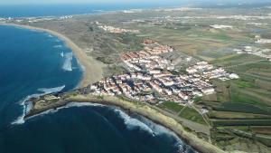 an aerial view of a village next to the ocean at Consolação Pedramar in Peniche