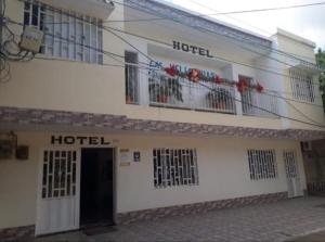 a hotel with two balconies on a building at Hotel heliconias mompox in Mompós