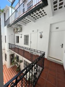 an empty hallway with a staircase in a house at Hostal Atenas in Seville