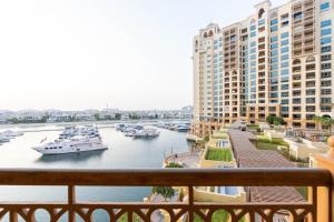 a view of a harbor with boats in the water at Sea and Atlantis View 3 BR Apartment Palm Jumeirah in Dubai