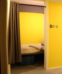 Postel nebo postele na pokoji v ubytování Stamps Backpackers