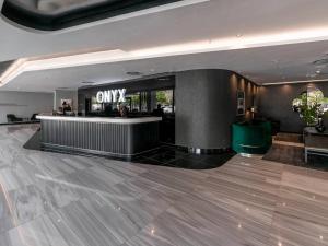 a lobby with a bar in a hotel at Luxury City Living - 1 Bedroom with balcony in Cape Town