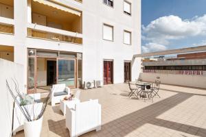 a patio of a building with a table and chairs at Casa Mabel Terrace - Lecce Selection in Lecce